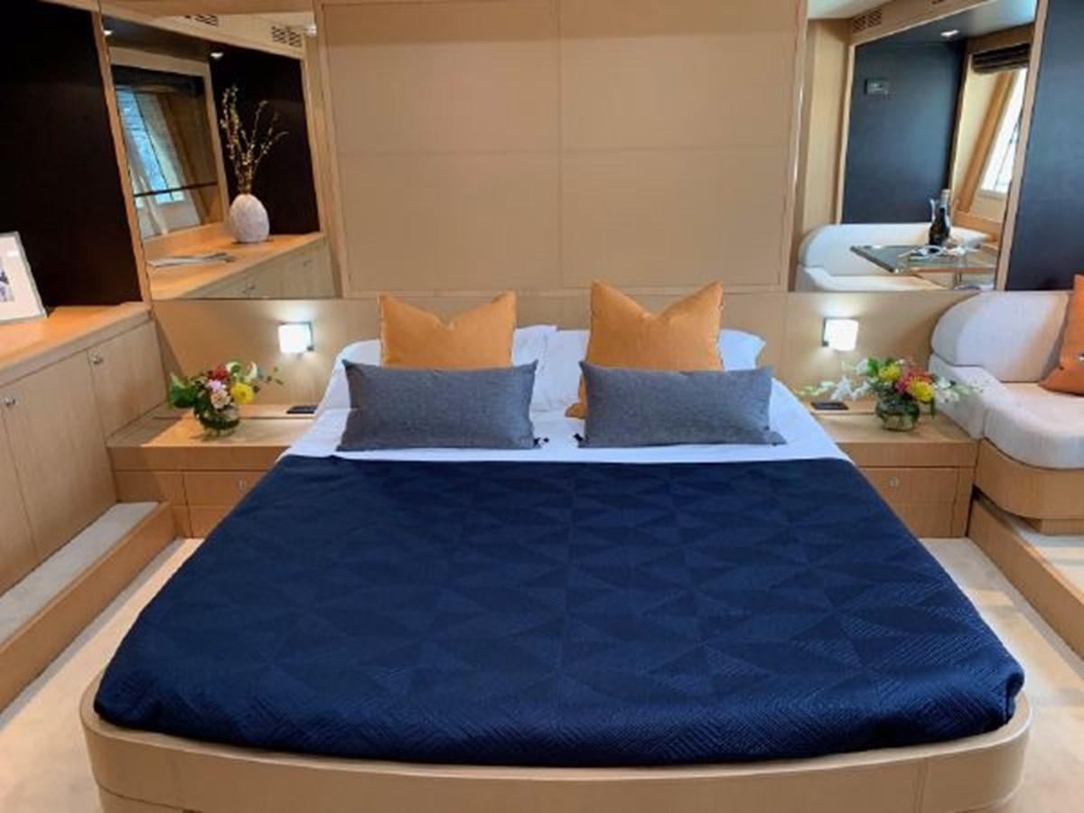 a bed with blue sheets aboard 2013 RIVA 75 VENERE SUPER Yacht for Sale