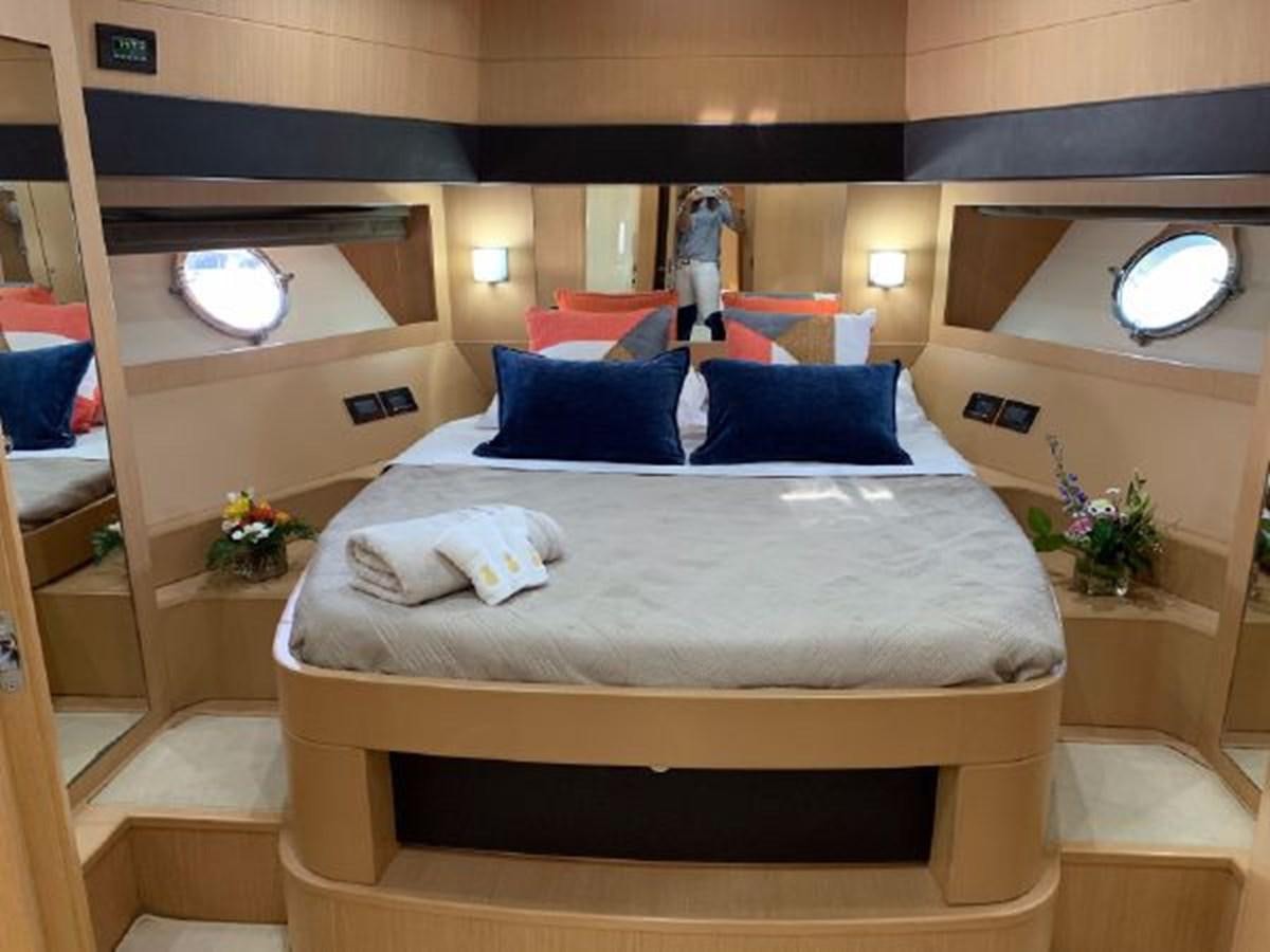 a bed with a white sheet and pillows on it aboard 2013 RIVA 75 VENERE SUPER Yacht for Sale