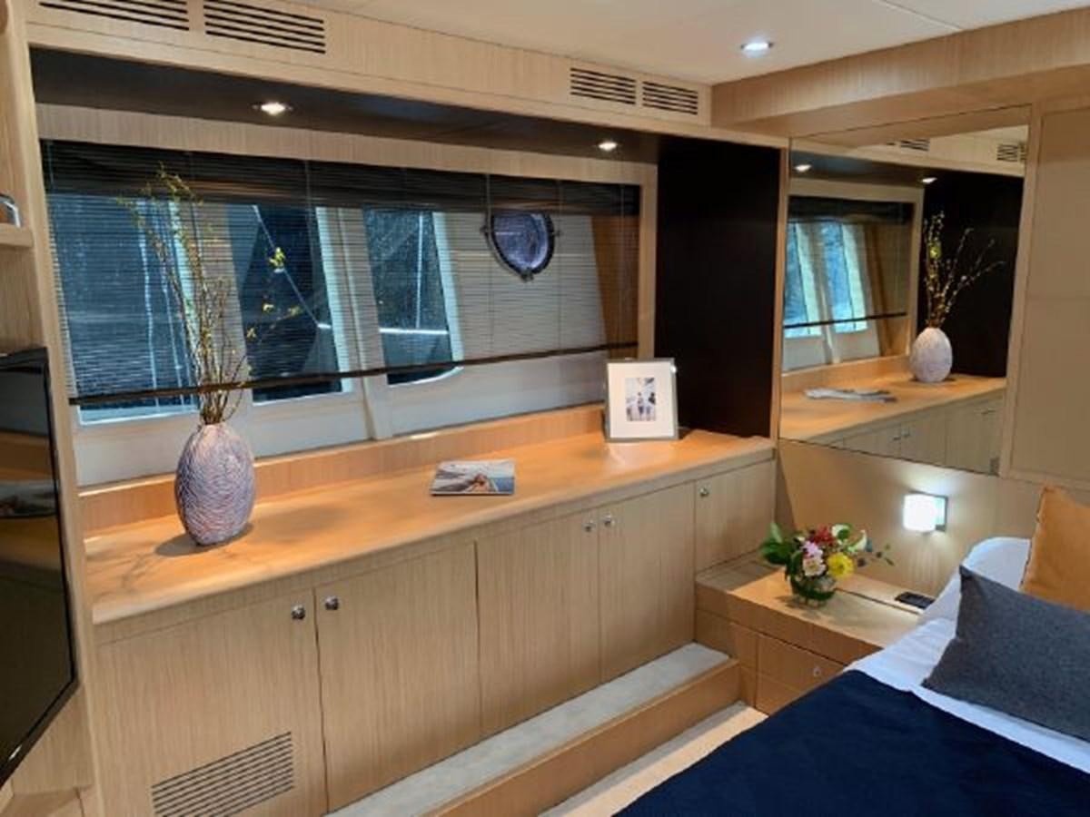 a room with a window and a desk with a vase on it aboard 2013 RIVA 75 VENERE SUPER Yacht for Sale