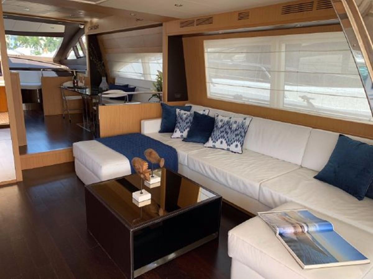 a living room with a couch and a coffee table aboard 2013 RIVA 75 VENERE SUPER Yacht for Sale
