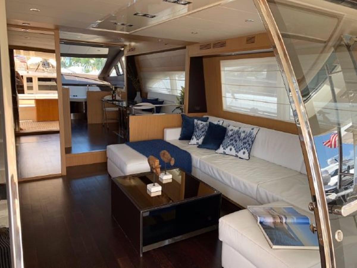 a living room with a couch and a table aboard 2013 RIVA 75 VENERE SUPER Yacht for Sale