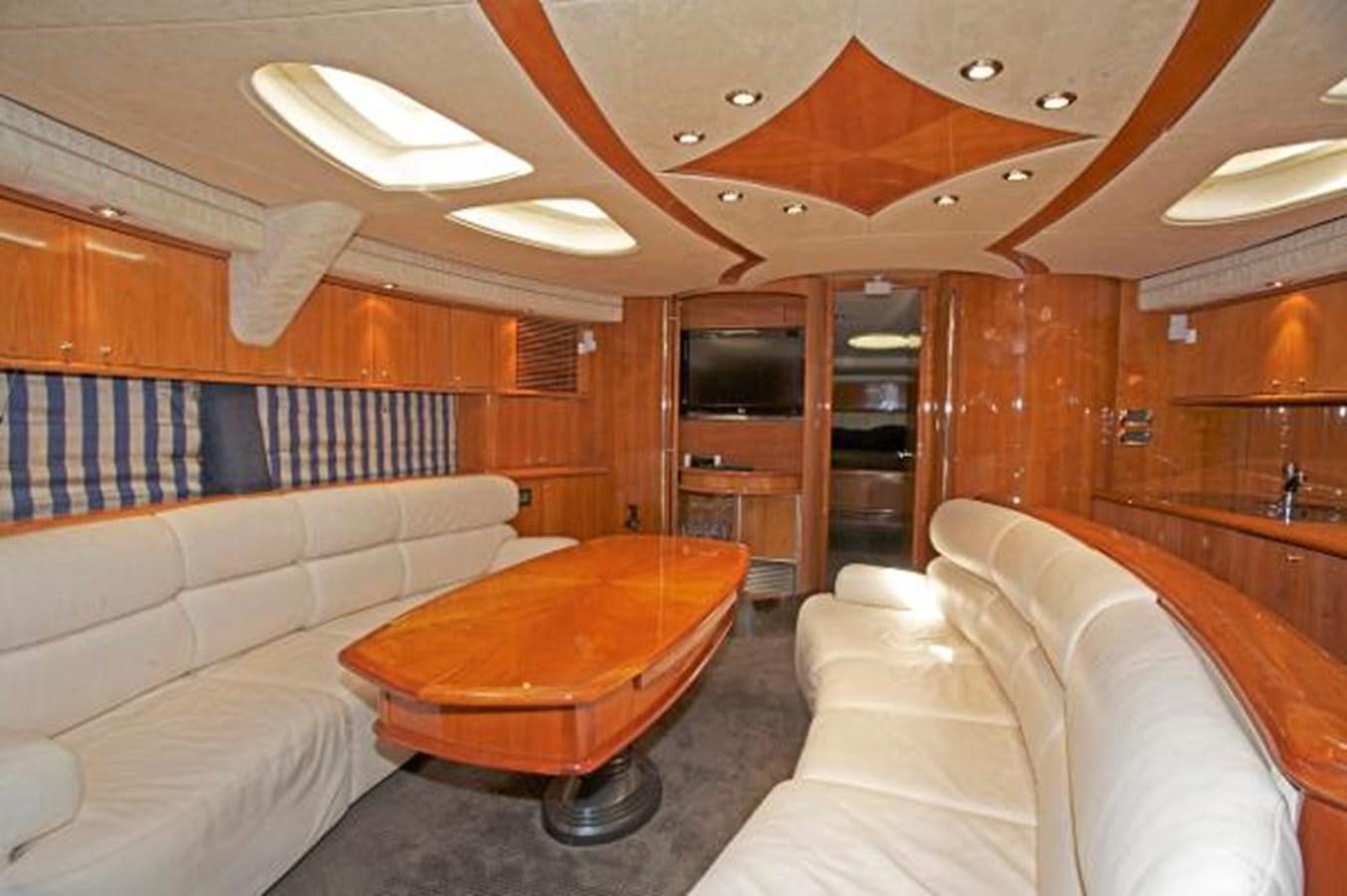 a living room with a couch and a television aboard H2 Yacht for Sale