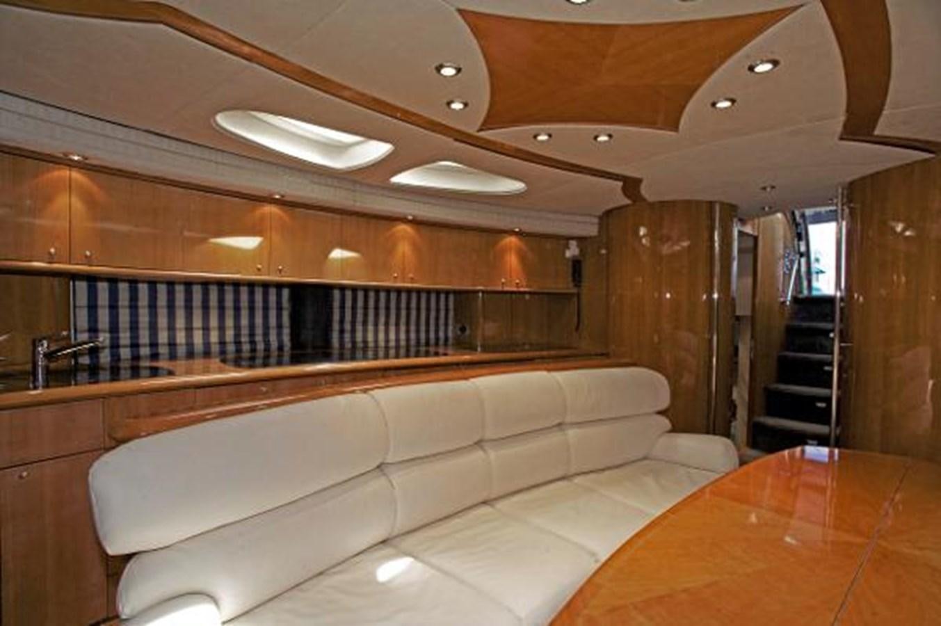 a room with a couch and a table aboard H2 Yacht for Sale