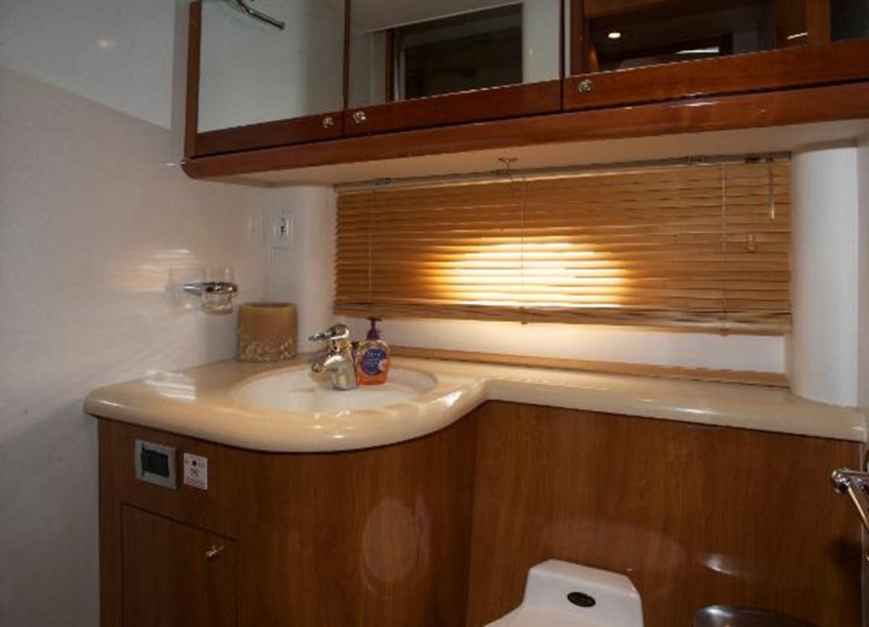 a bathroom with a sink and a mirror aboard H2 Yacht for Sale
