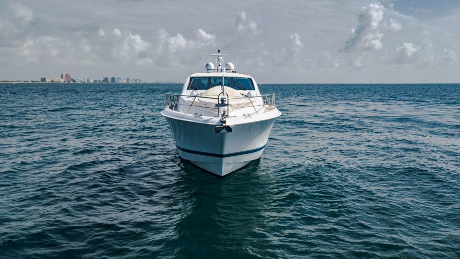 a white boat in the water aboard MOJO Yacht for Sale