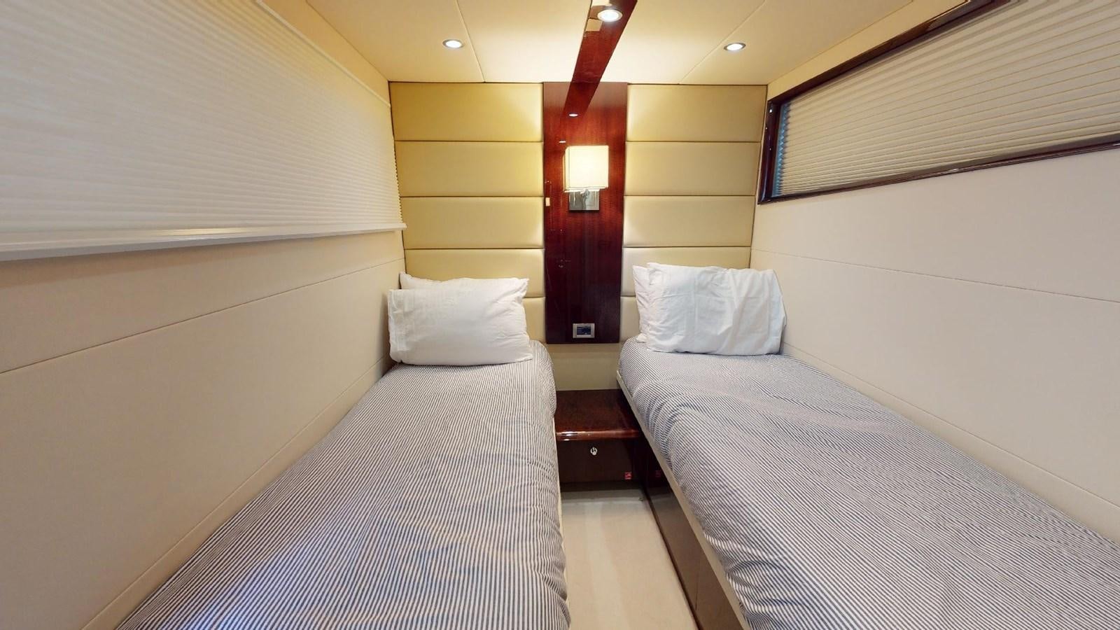 a room with two beds aboard MOJO Yacht for Sale