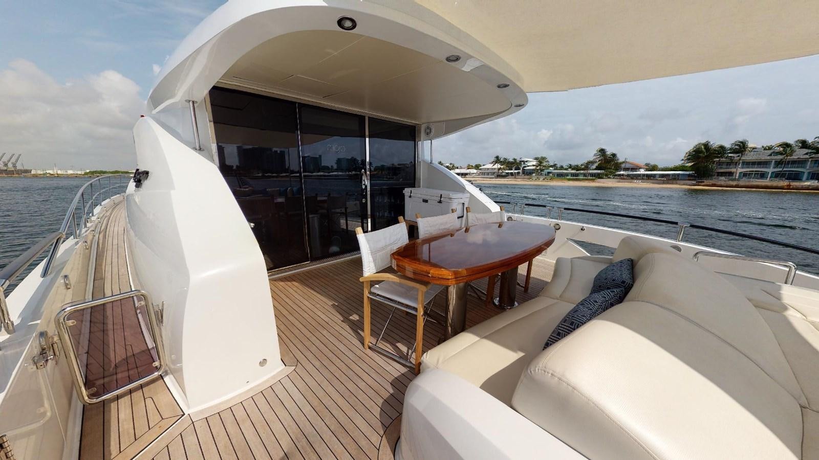 a boat on a deck aboard MOJO Yacht for Sale