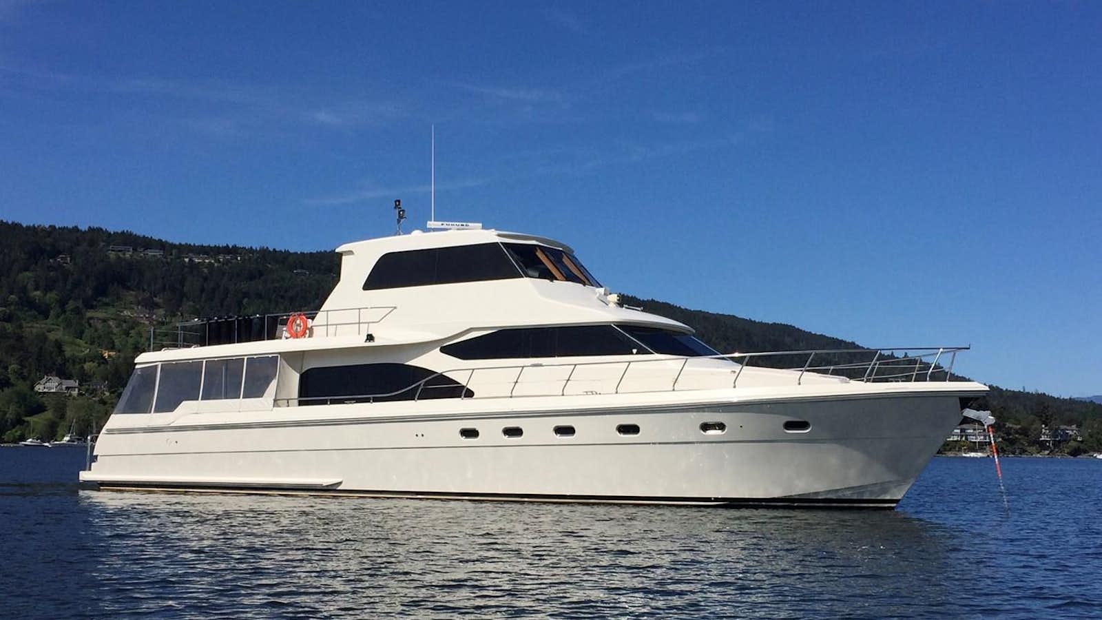 a white yacht in the water aboard TAKEN TIME II Yacht for Sale