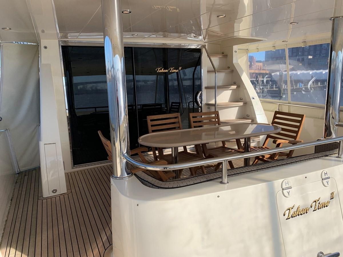 a room with tables and chairs aboard TAKEN TIME II Yacht for Sale