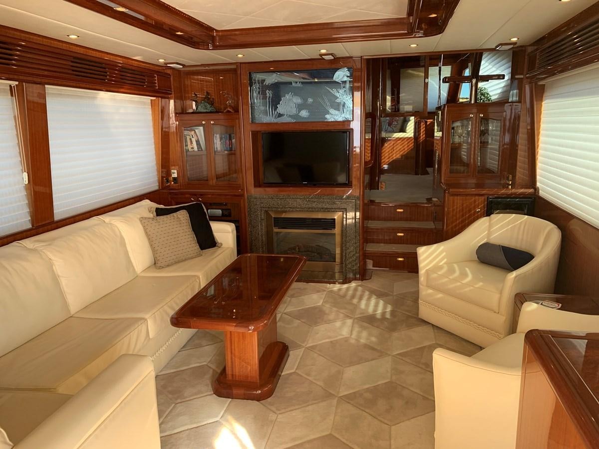 a living room with a fireplace aboard TAKEN TIME II Yacht for Sale