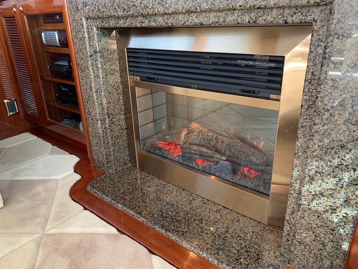 a fireplace in a room aboard TAKEN TIME II Yacht for Sale