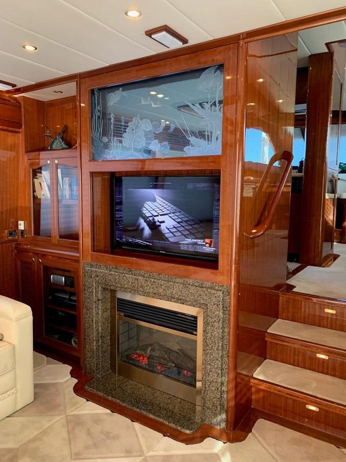 a fireplace in a room aboard TAKEN TIME II Yacht for Sale