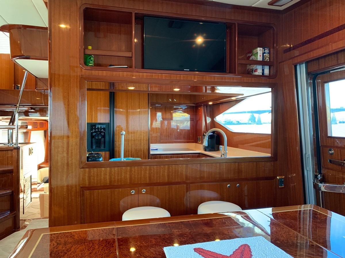 a room with a table and chairs aboard TAKEN TIME II Yacht for Sale