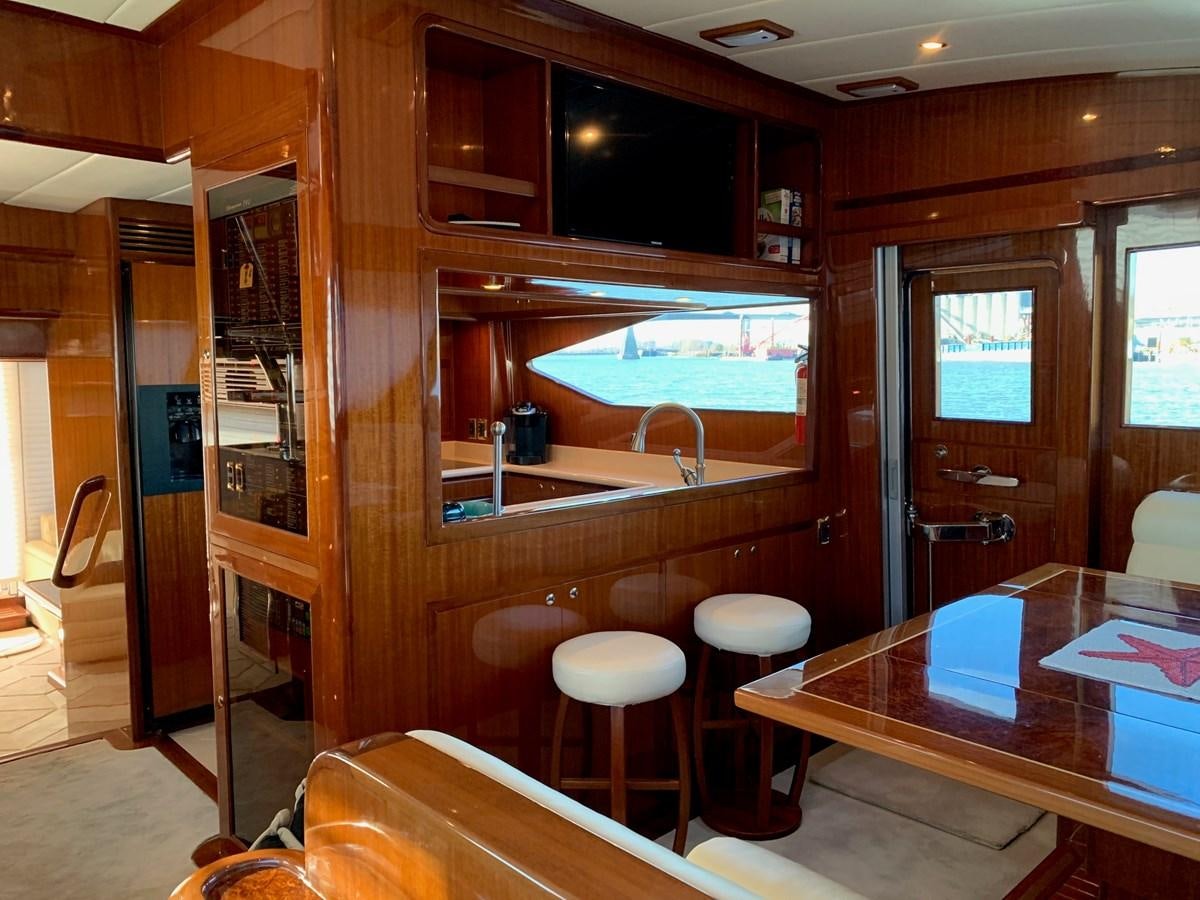 a room with a table and chairs aboard TAKEN TIME II Yacht for Sale