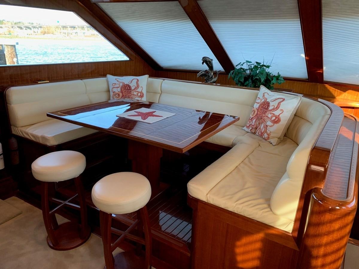 a room with a table and chairs aboard TAKEN TIME II Yacht for Sale