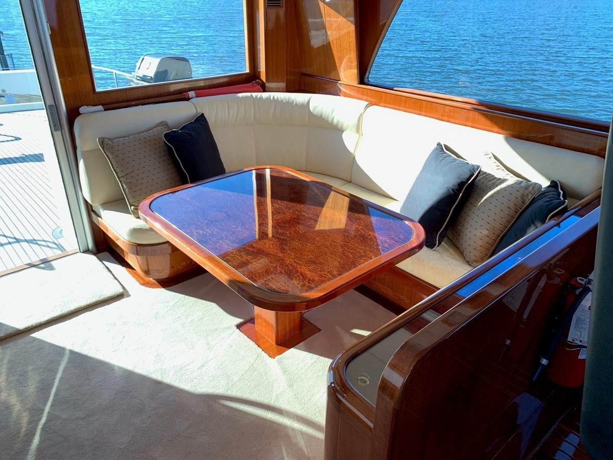 a table and chairs in a room aboard TAKEN TIME II Yacht for Sale