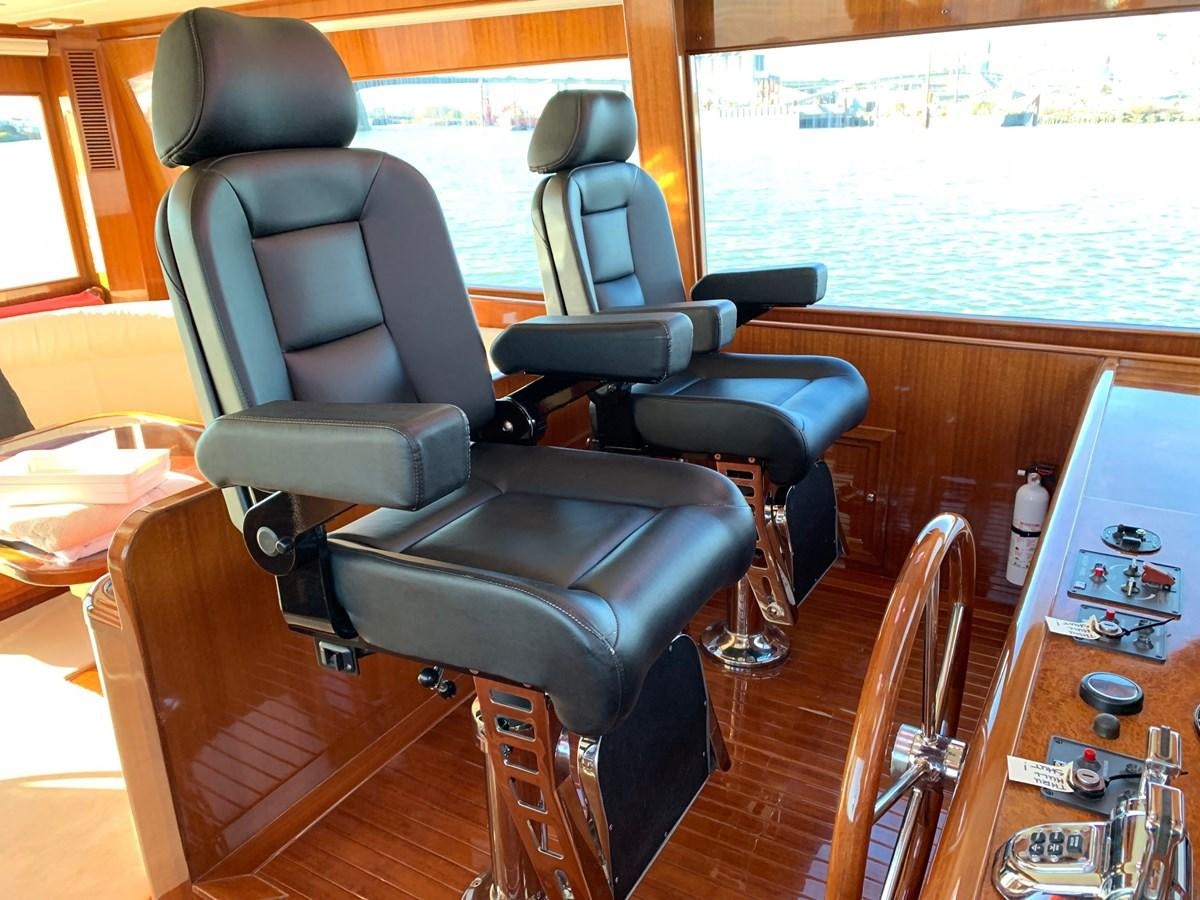 a room with a table and chairs aboard TAKEN TIME II Yacht for Sale
