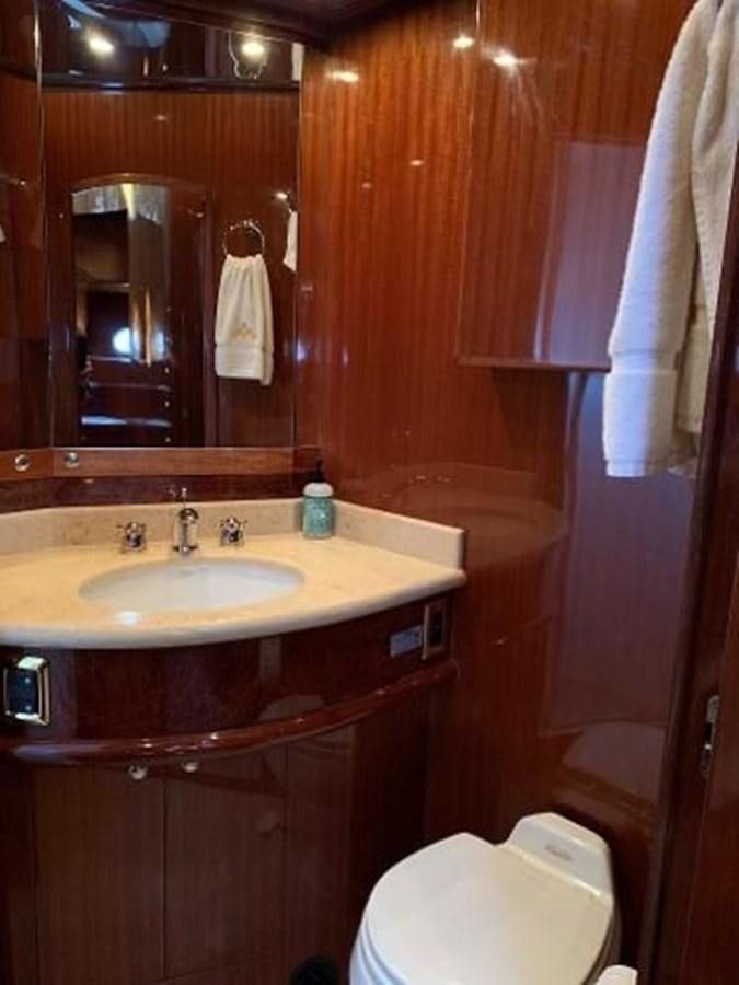 a bathroom with a sink and toilet aboard TAKEN TIME II Yacht for Sale