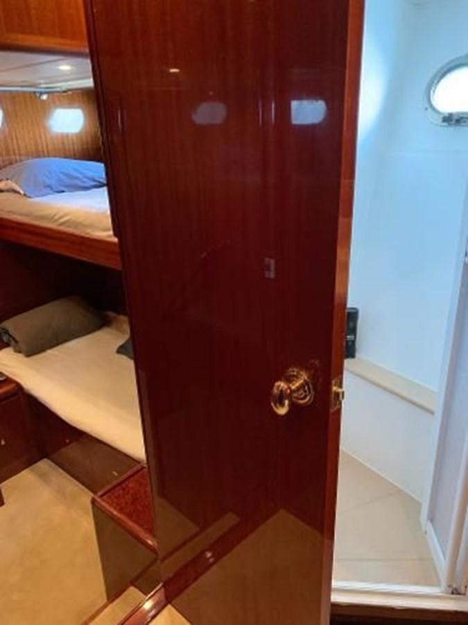 a red door in a room aboard TAKEN TIME II Yacht for Sale