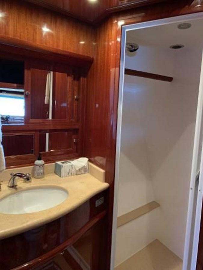 a bathroom with a sink and a mirror aboard TAKEN TIME II Yacht for Sale