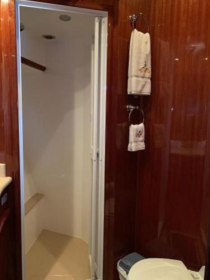 a bathroom with a red door aboard TAKEN TIME II Yacht for Sale