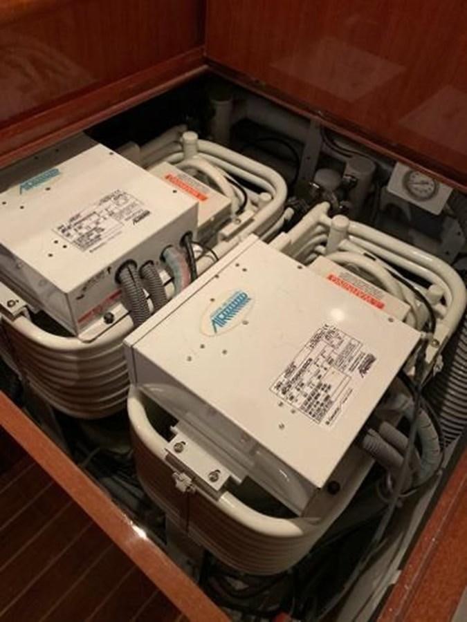 a white box with wires and a white box with a white box inside aboard TAKEN TIME II Yacht for Sale