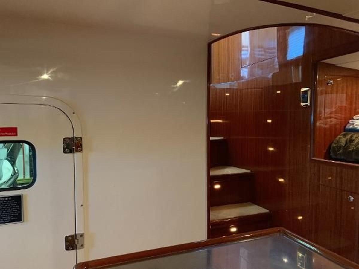 a mirror showing a room with a bed and a dresser aboard TAKEN TIME II Yacht for Sale