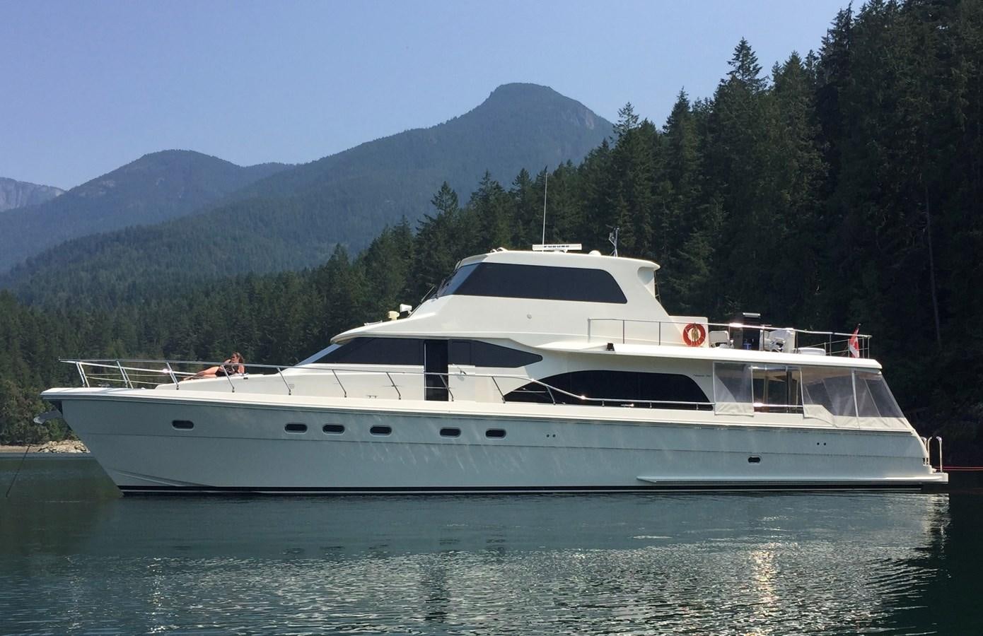 a white yacht on the water aboard TAKEN TIME II Yacht for Sale