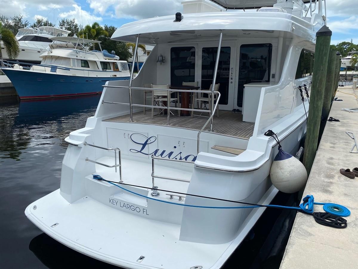 a boat docked at a pier aboard LUISA Yacht for Sale
