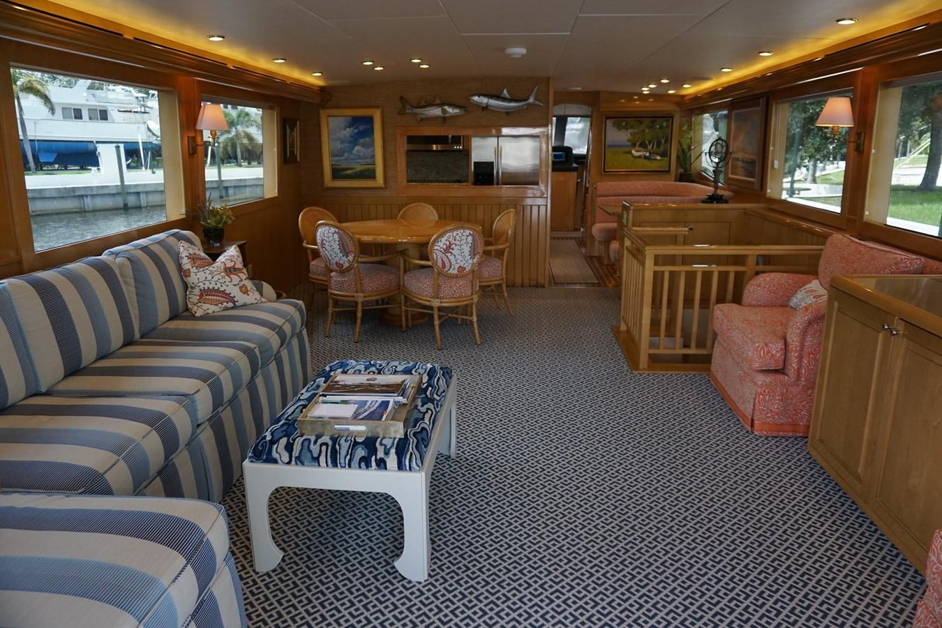 a living room with a couch and chairs aboard LUISA Yacht for Sale