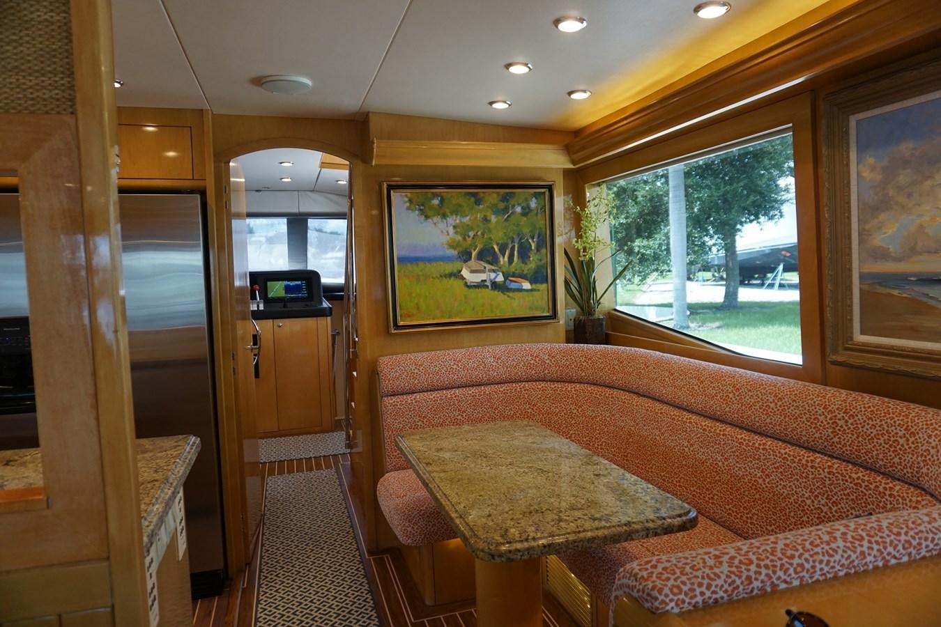 a living room with a couch and a tv aboard LUISA Yacht for Sale