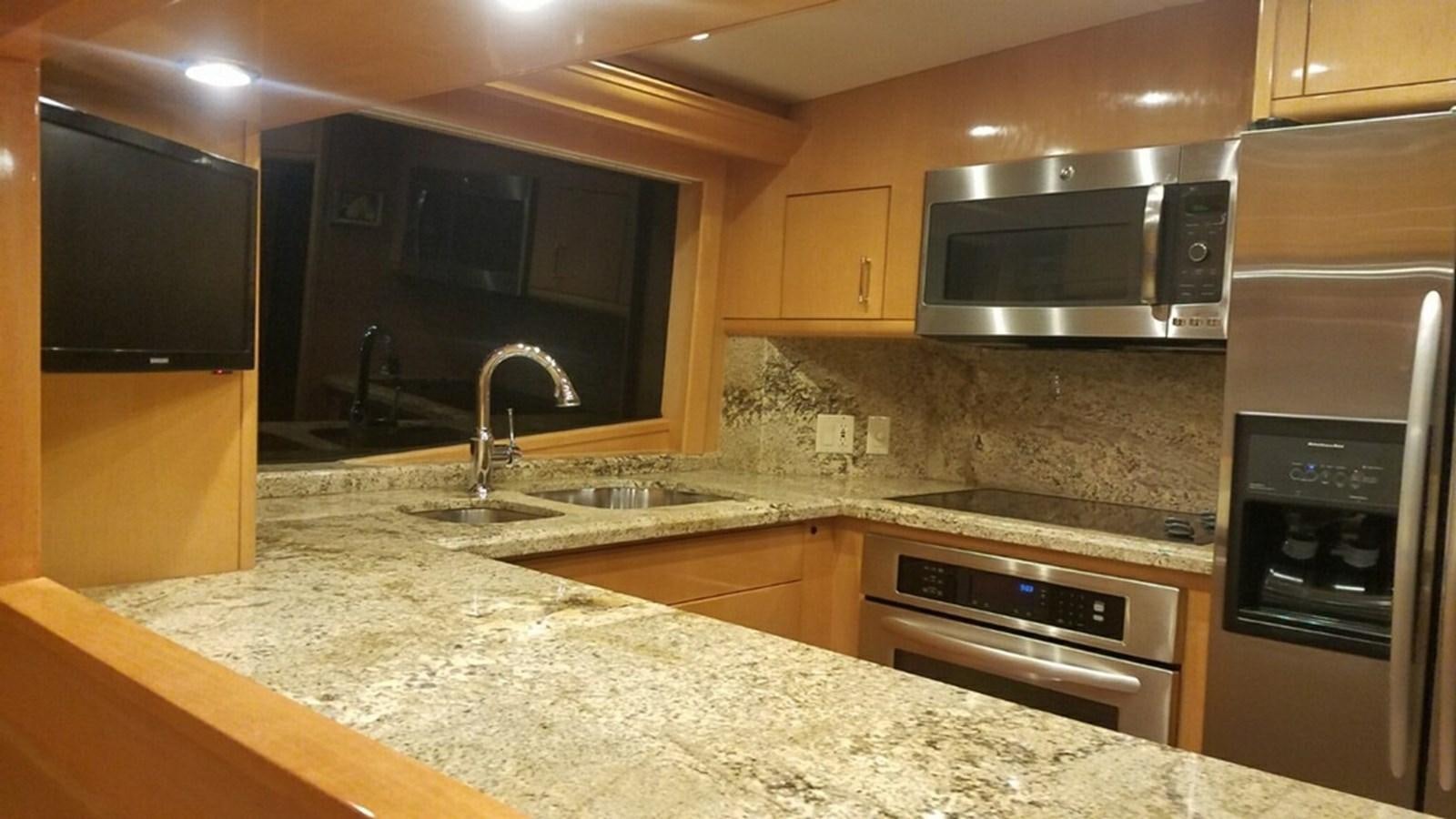 a kitchen with granite counter tops aboard LUISA Yacht for Sale