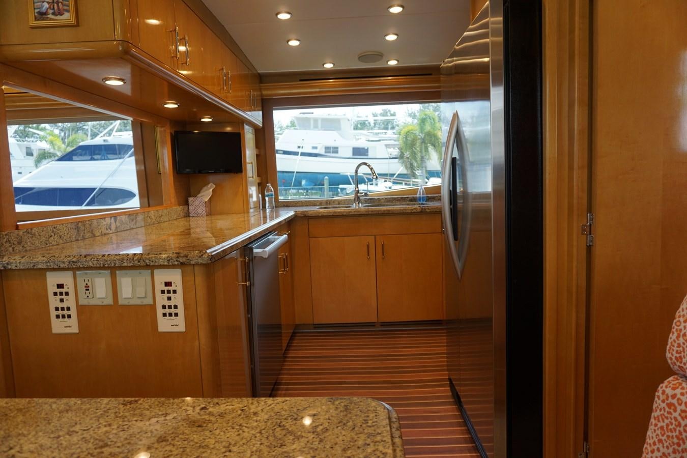 a kitchen with a large window aboard LUISA Yacht for Sale