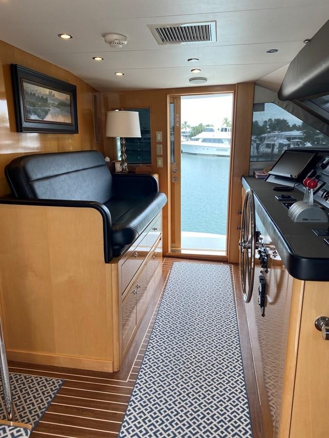 a living room with a couch and a table aboard LUISA Yacht for Sale