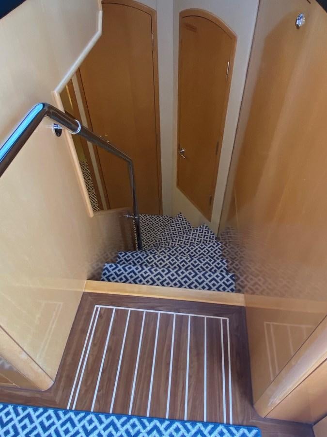 a bathroom with a blue rug aboard LUISA Yacht for Sale