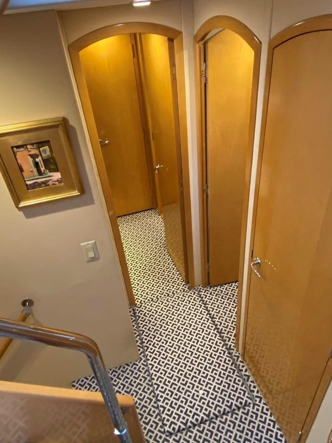 a bathroom with a tiled floor aboard LUISA Yacht for Sale