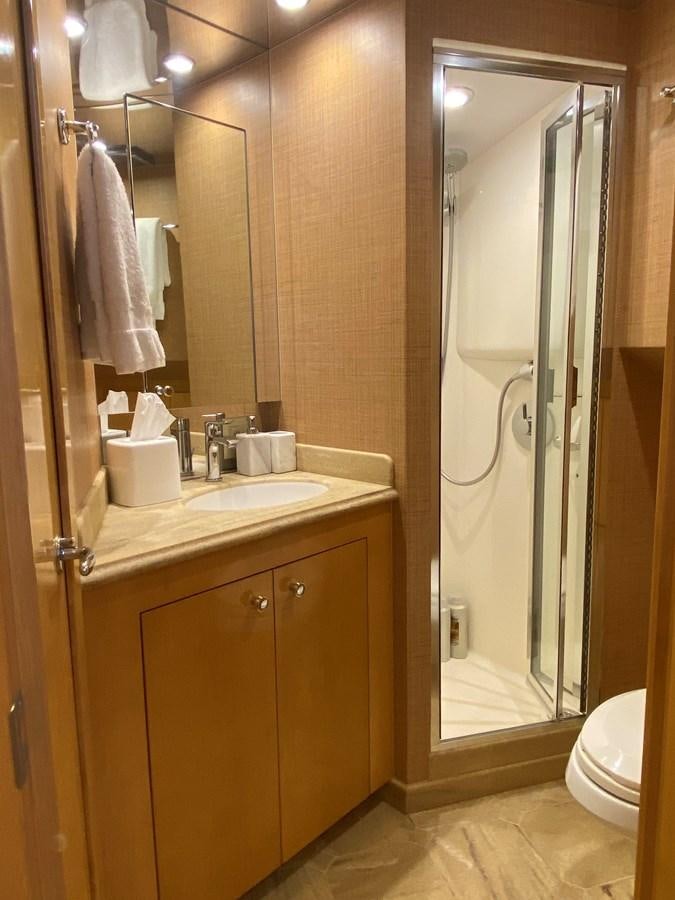 a bathroom with a glass shower door aboard LUISA Yacht for Sale