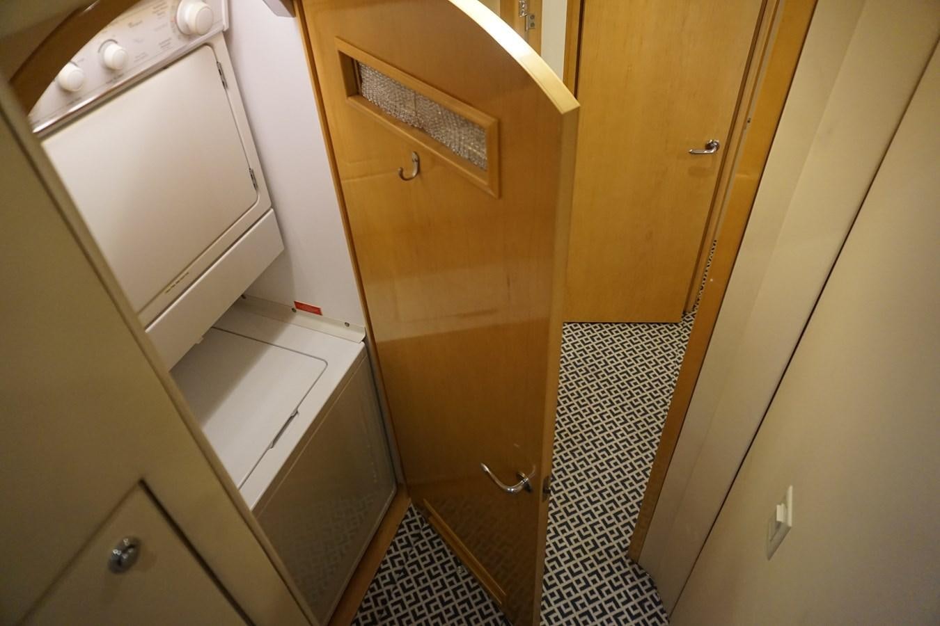 a room with cabinets and drawers aboard LUISA Yacht for Sale