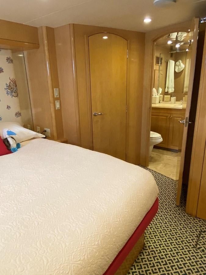 a bedroom with a large bed aboard LUISA Yacht for Sale