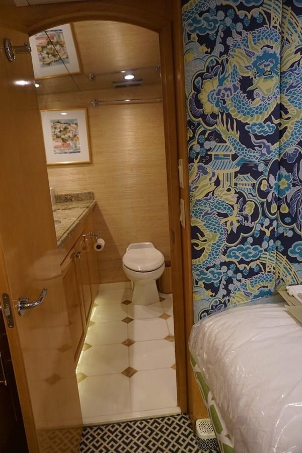 a bathroom with a shower curtain aboard LUISA Yacht for Sale