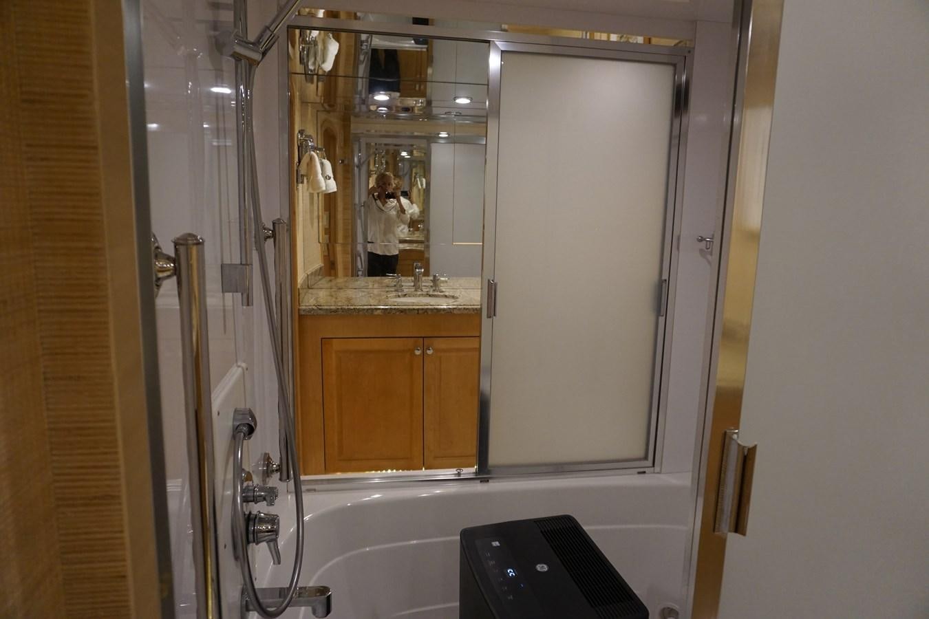 a bathroom with a large mirror aboard LUISA Yacht for Sale