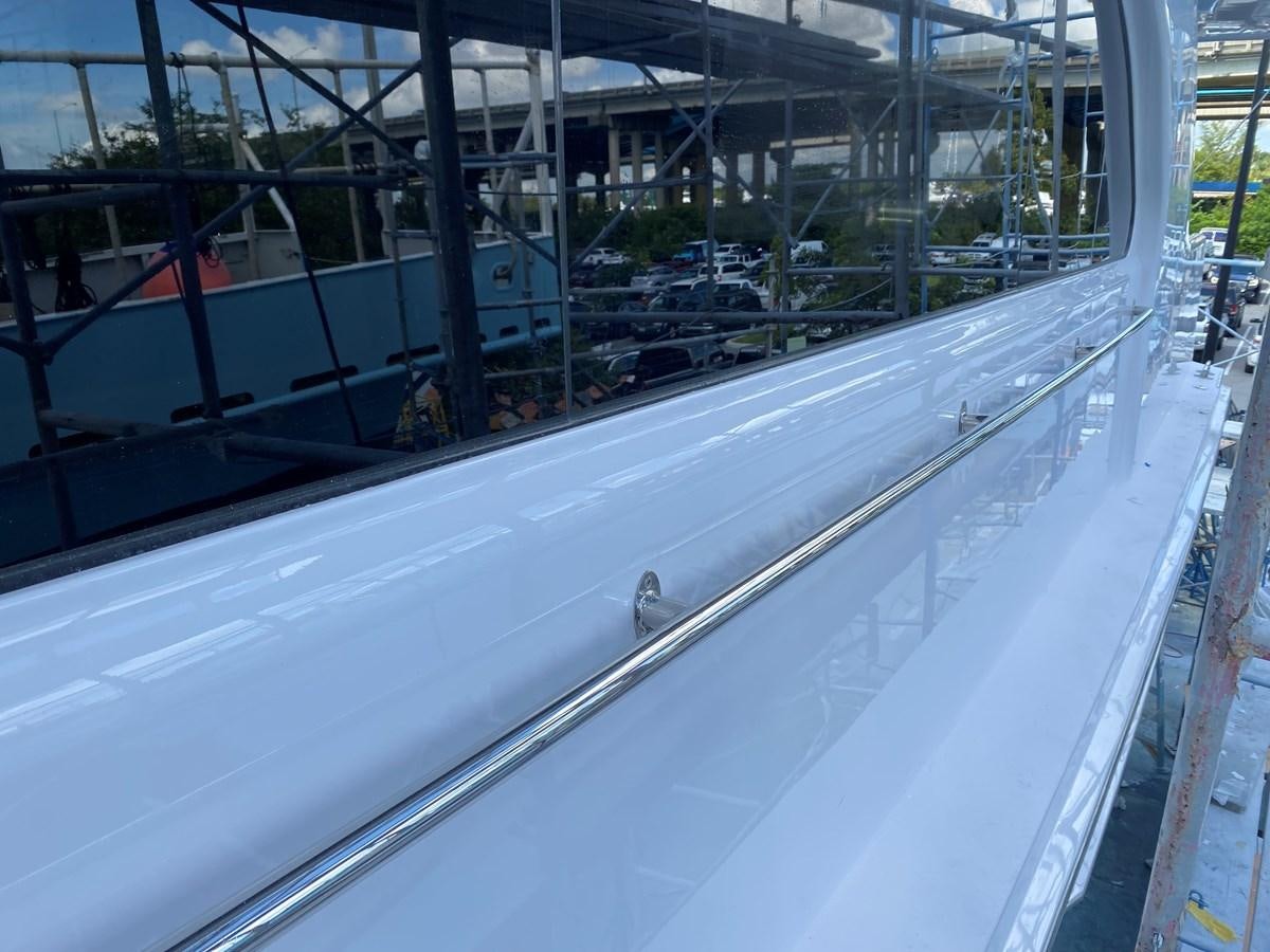 a large glass wall with a glass window aboard LUISA Yacht for Sale