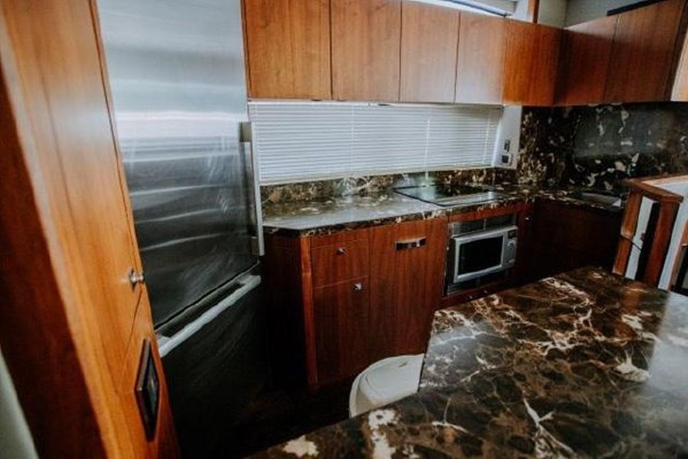 a kitchen with a granite counter top aboard ASTUR Yacht for Sale