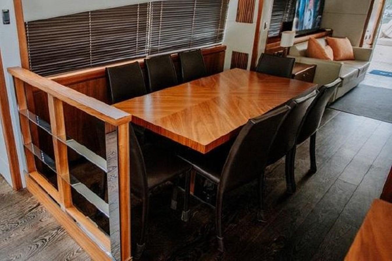 a table and chairs in a room aboard ASTUR Yacht for Sale
