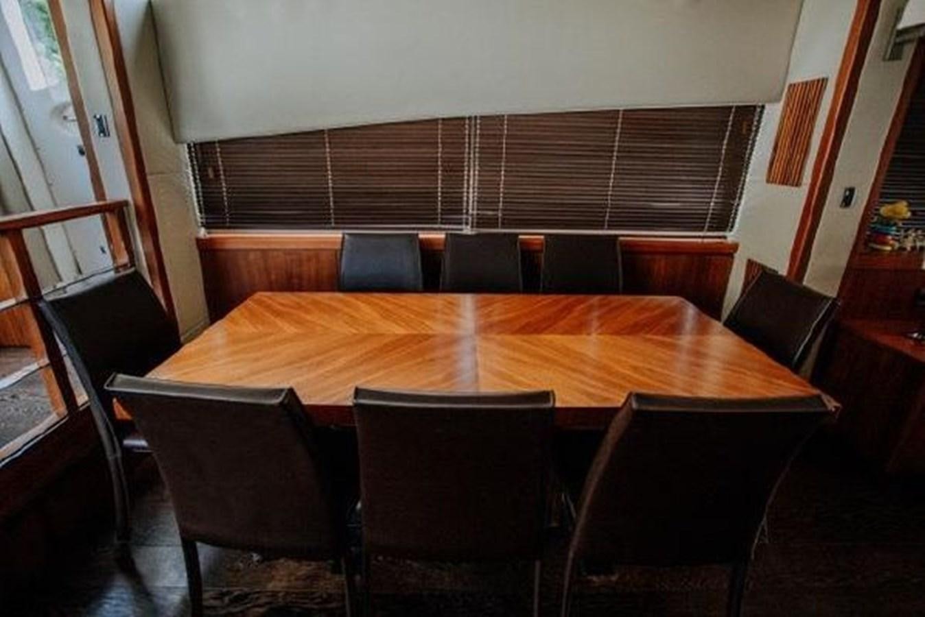a table with chairs around it aboard ASTUR Yacht for Sale