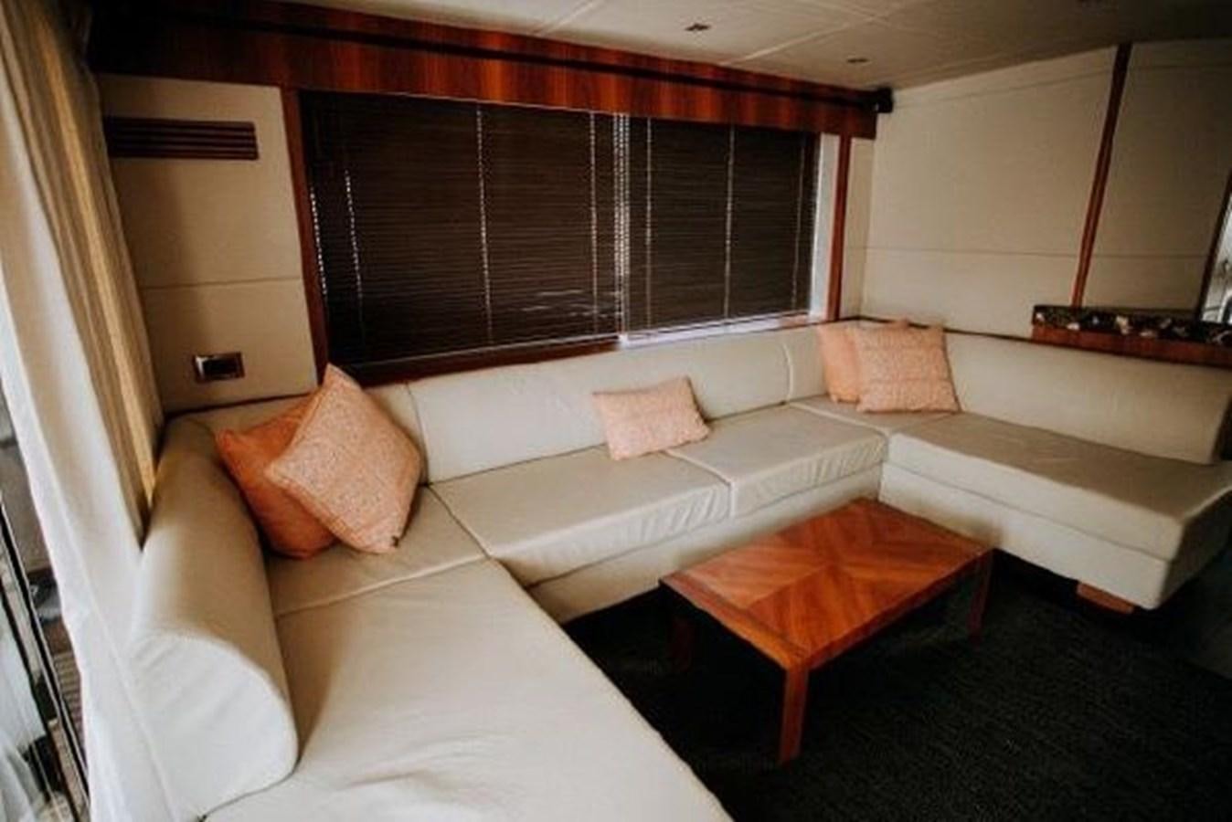 a living room with a couch and a table aboard ASTUR Yacht for Sale