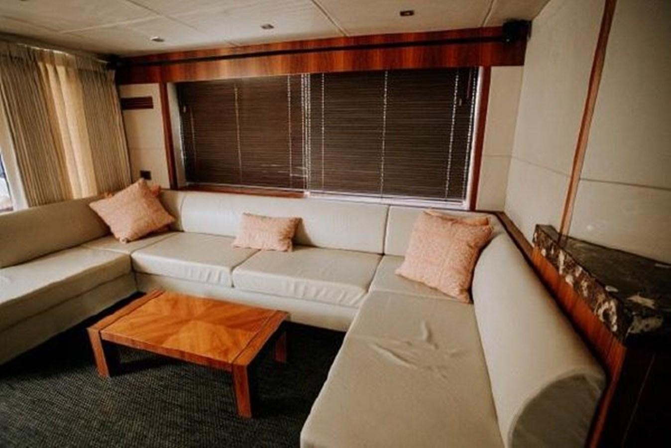 a living room with a couch and a coffee table aboard ASTUR Yacht for Sale