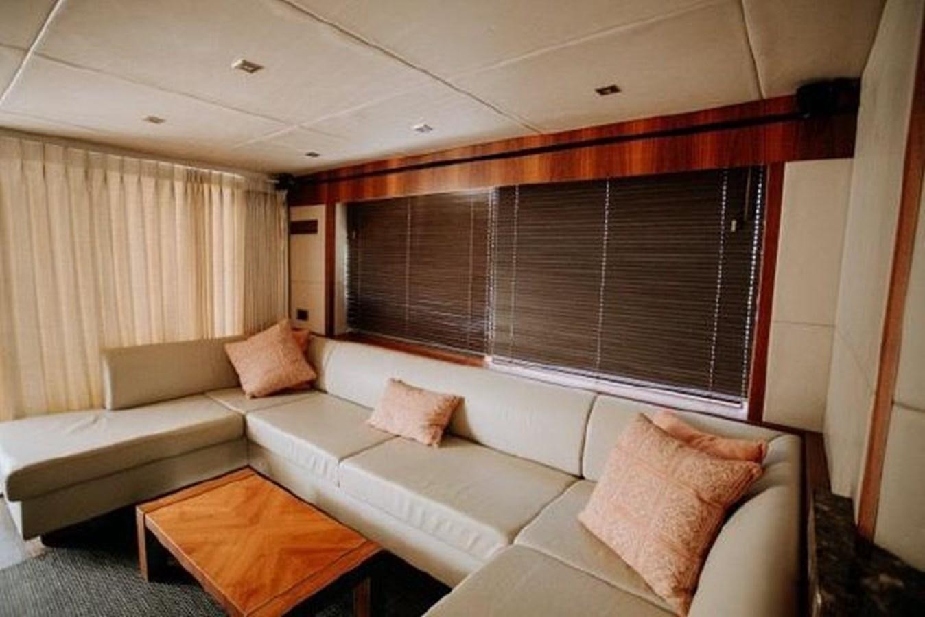 a living room with a couch and a table aboard ASTUR Yacht for Sale