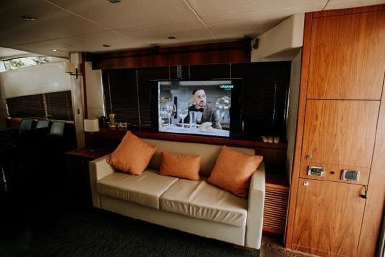 a living room with a large television aboard ASTUR Yacht for Sale