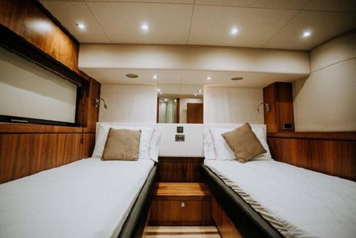 a room with two beds aboard ASTUR Yacht for Sale